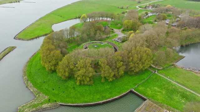 Aerial retreat pan up from the historic fort Honswijk near the river Lek in Netherlands