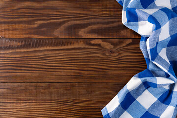 Obraz premium Blue tablecloth on wooden background