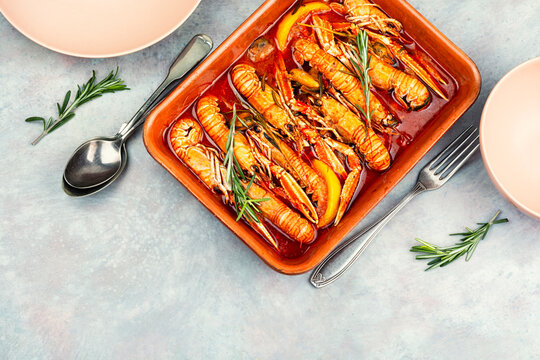 Mediterranean langoustines with mussels in aromatic tomato wine sauce