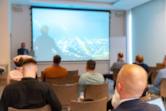 Blurred view of a corporate conference room with people