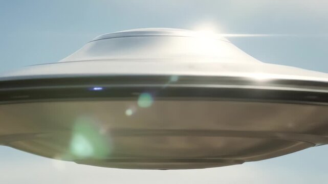 A shiny metallic disc-shaped UFO or flying saucer hovering in a bright sky with lens flare, suggesting an extraterrestrial encounter.
