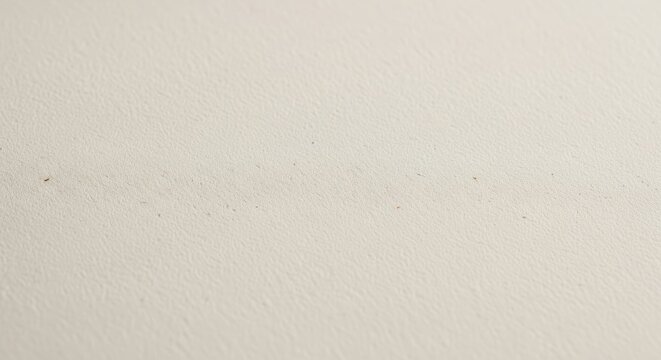 a close up of a white wall with a few small spots on it looking empty and clean in a room with no fu