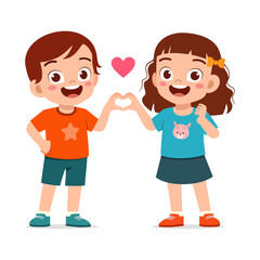 Fototapeta premium Happy smiling little boy and girl making a heart shape with their hands showing love and friendship