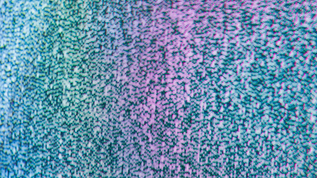 Colorful crt tv static noise with vivid pink and blue teal pixel gradient texture close-up
