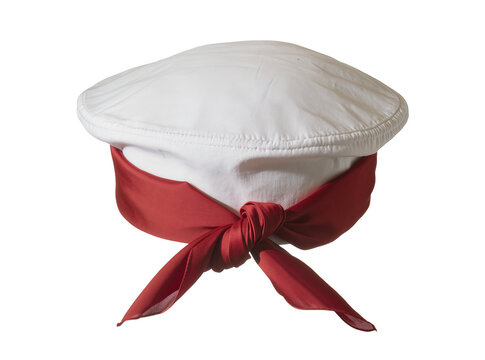 Isolated traditional white cap with red fabric band tied in a knot, ethnic headwear.