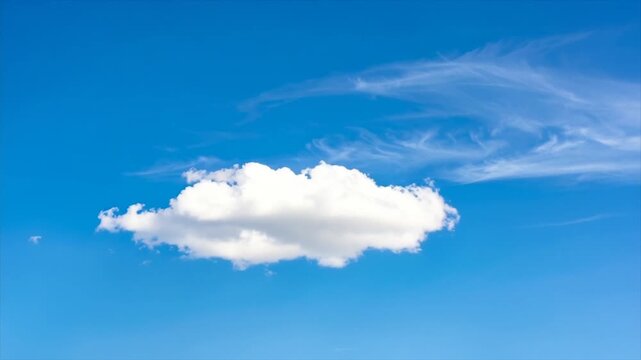 Bright blue sky with puffy white cloud. Wispy cirrus clouds in background. Peaceful, serene scene