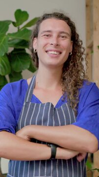 Vertical video: Camera starting, host introducing self in studio, smiling with striped apron