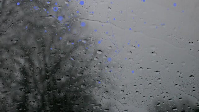 Steady rain forming and merging on windshield, creating blue reflections for automotive design