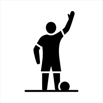 Soccer player raising hand for offside call.
