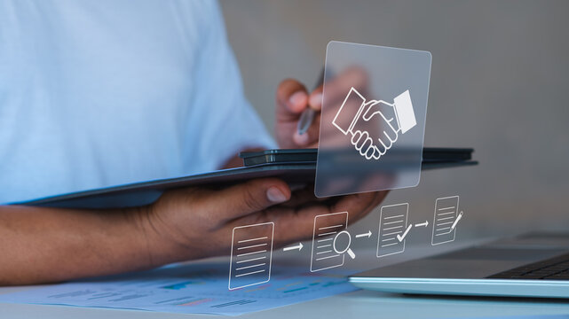 Procurement process management, Digital and paper document approval, contract verification, supplier negotiation, and business purchasing operations using laptop and paper in office environment