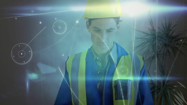 HUD activating, site engineer in safety vest donning helmet while tapping tablet to view plans