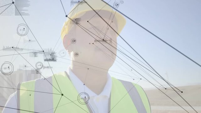 Construction lead scanning in yellow helmet neon vest, camera shifting growing HUD for site check