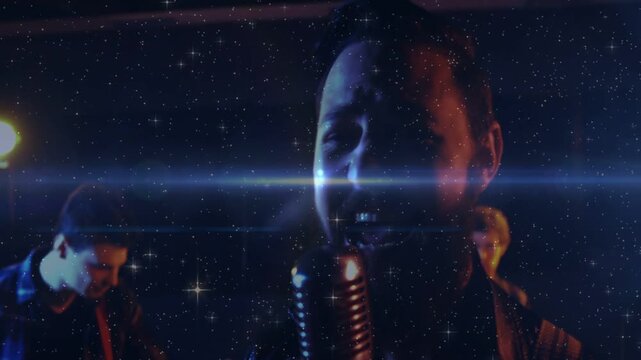 Lens flare sweeping, drummer hitting, guitar playing, camera zooming, singer singing, showing lead