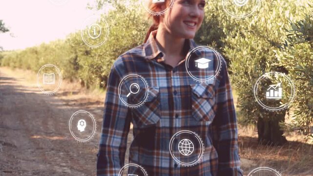 Vertical video: Woman walking toward camera on path, initiating floating education icons around her