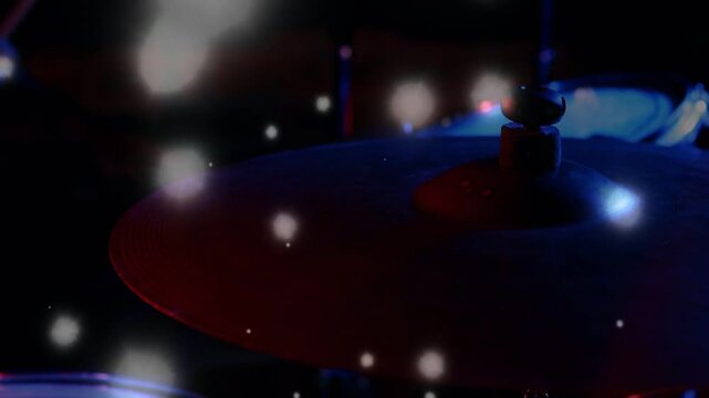 Stick striking cymbal, hands causing shimmer during gig, red blue bokeh orbs highlighting curvature