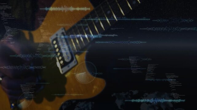 Guitarist playing amber guitar in studio, fretting and picking near pickup while HUD driving signal