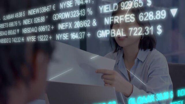 Woman taking pages after market tickers appearing, reading while tickers shifting for market review