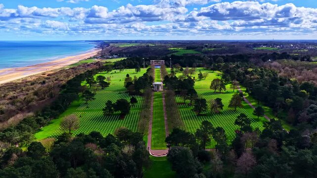 Aerial View Of Normandy American Cemetery In Colleville-sur-Mer, France, Overlooking Omaha Beach And Atlantic Ocean. timelapse