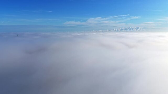 Aerial descent window view thick layer of clouds fog from above cloudscape video footage