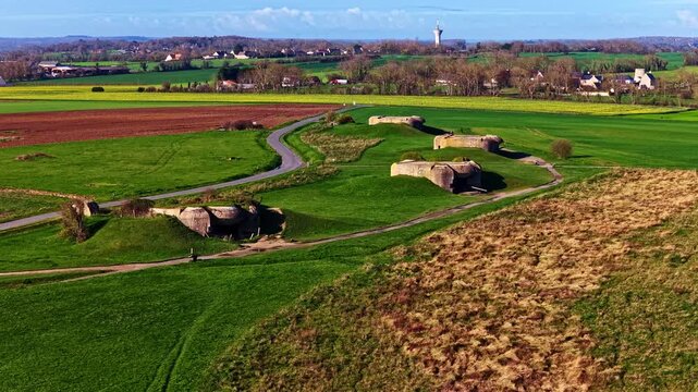 German Coastal Artillery Battery At Longues-sur-Mer - Key Site Of D-Day Landings In Normandy, France. pullback drone shot