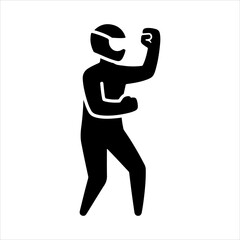 Fototapeta premium Silhouette of a person in a helmet with a raised fist ready for action.