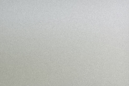 Even neutral gray field with very fine grain texture and soft lighting, ideal as a versatile backdrop for typography, product presentations, web design, or branding projects.