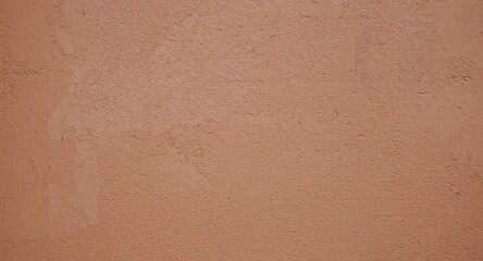 Fototapeta premium Textured close view of a weathered brown wall with natural landscape peeling paint effect