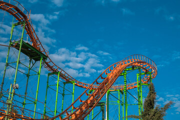 Orange Roller Coaster Track and Green Support Beams © jackreznor