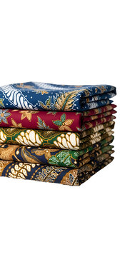 Stack of folded colorful batik fabrics with traditional patterns in a pile close-up studio shot on black background cultural textiles and fabrics