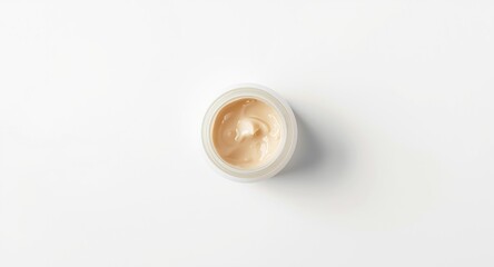 Fototapeta premium White background with copy space showing top view of cocoa butter skincare