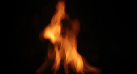Fototapeta premium Softly blurred flame fire burning on a dark black background