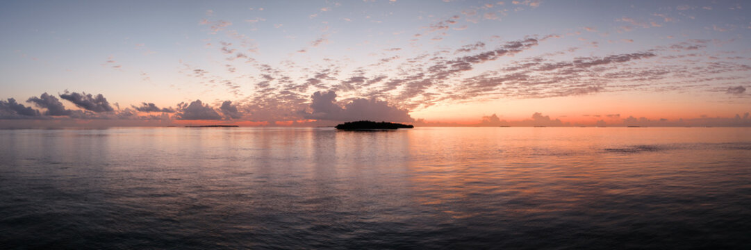 Panoramic view of small island in the Indian ocean at sunset, Maldives