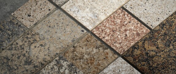 Obraz premium Overhead perspective of interior finish samples including stone tiles and terrazzo on simple background