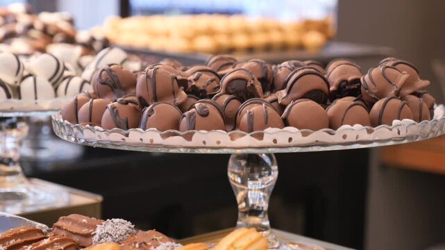 Chocolates on a glass plate at a sweet shop