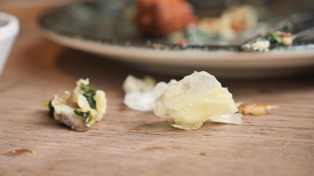 Plate left with food scraps and leftovers from meal