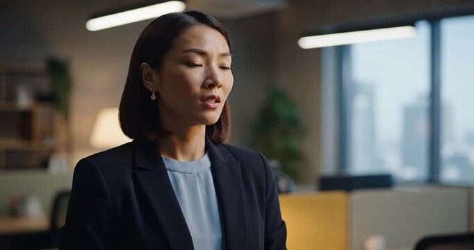 Confident businesswoman stands in modern office, contemplating strategy amidst urban backdrop