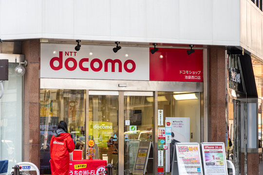 TOSHIMA, TOKYO, JAPAN - APRIL 3, 2026: The storefront exterior and official branding of an NTT docomo shop, a leading mobile telecommunications provider, in Toshima, Tokyo.