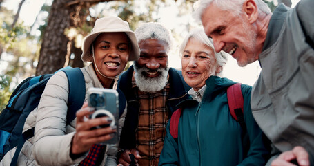 Fototapeta premium Nature, hiking and selfie with group of friends and smile for adventure with retirement, wellness and health. Travel, picture and mature people with backpacking for social media, memory and post