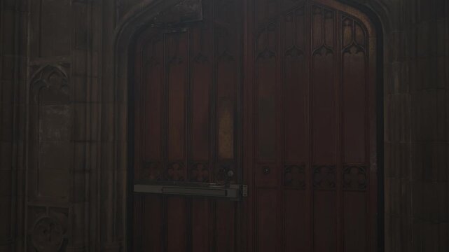 Large Ornate Wooden Cathedral Doors Opening to Bright Light.