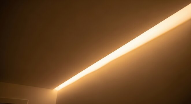 Soft diffused warm light strip illuminating a modern interior ceiling and wall corner