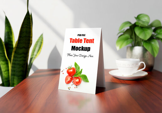 Restaurant Table Tent Mockup on Wooden Desk with Coffee Cup and Indoor Plant