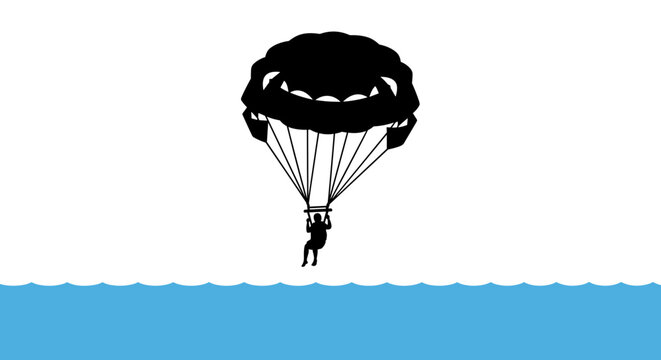 Man parachuting over the ocean.