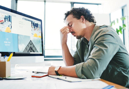 Office, pain and business man with headache for deadline pressure, burnout or advertising error. Fatigue, migraine and worker with brain fog, stress or tired with brand challenge on computer screen