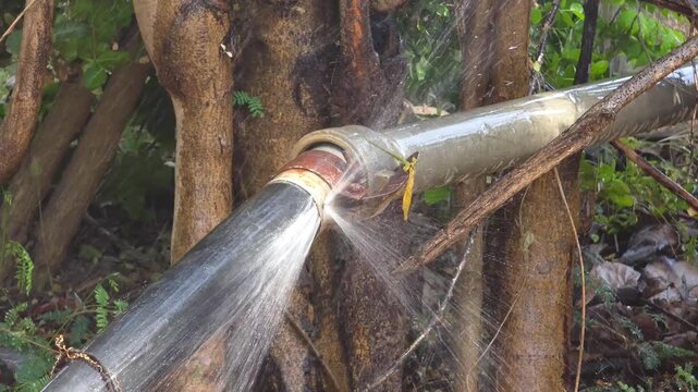 Water Leakage from Pipe Joint in Rural Area &ndash; Irrigation System 4K Footage