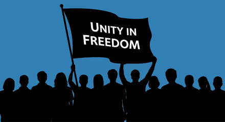 A crowd of diverse people holding a flag with the message Unity in Freedom. © Aagil_Umais