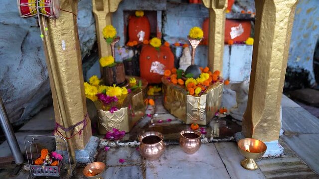 Small local Hindu temple in village with Shivling and Lord Hanuman idol, showcasing rural religious life and traditional worship in India.