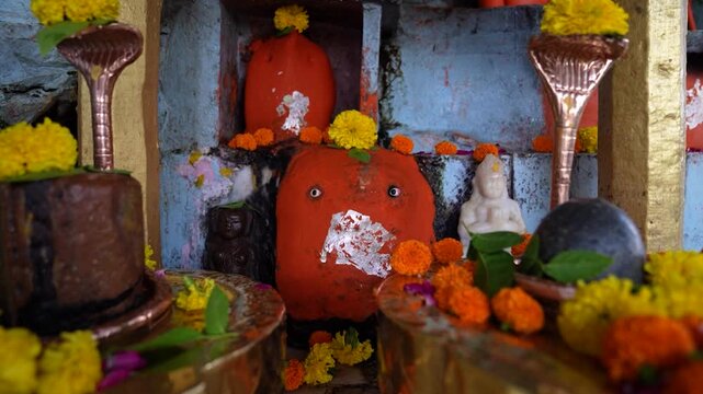 Small local Hindu temple in village with Shivling and Lord Hanuman idol, showcasing rural religious life and traditional worship in India.