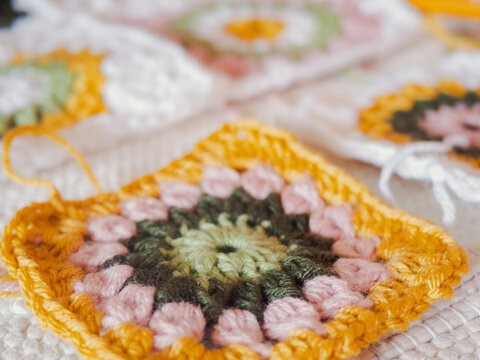 Granny square crochet work with colorful yarn