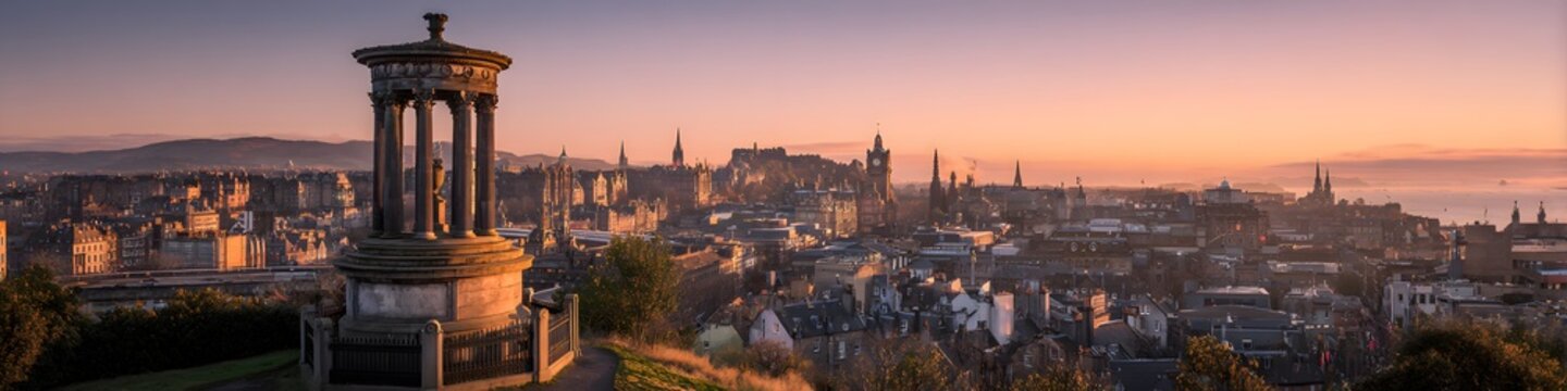 Sunset bathes Edinburgh in warm, golden light