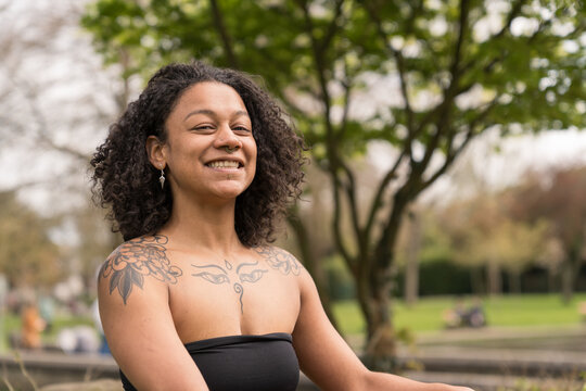 Happy black woman smiling outdoors enjoying freedom